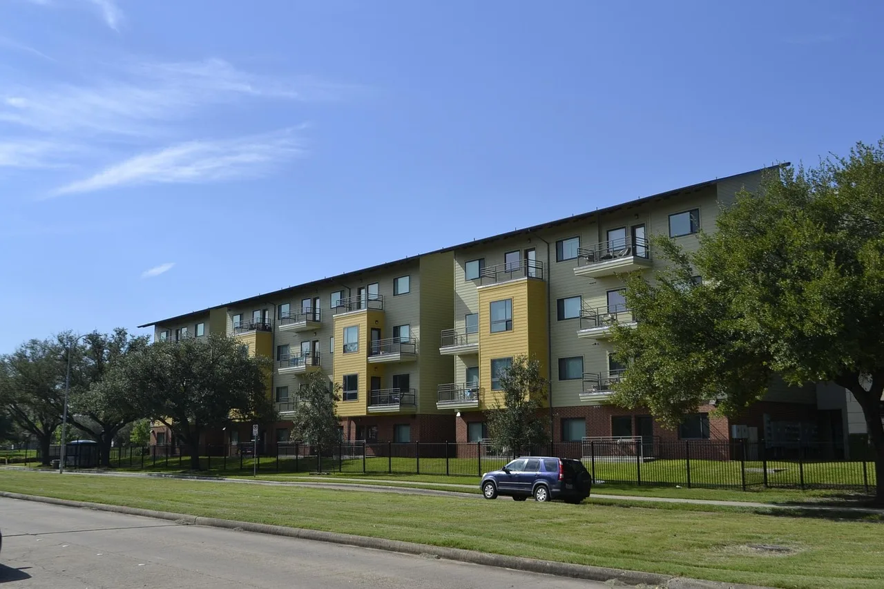 houston texas apartment complex, grass, blue sky, clear skies, housing, street, urban, neighborhood, estate, building, complex, sidewalk, blue, suburbs, block, city, apartments, nature, exterior, residential, development, property, sky. Property management markets worth entering for 2027